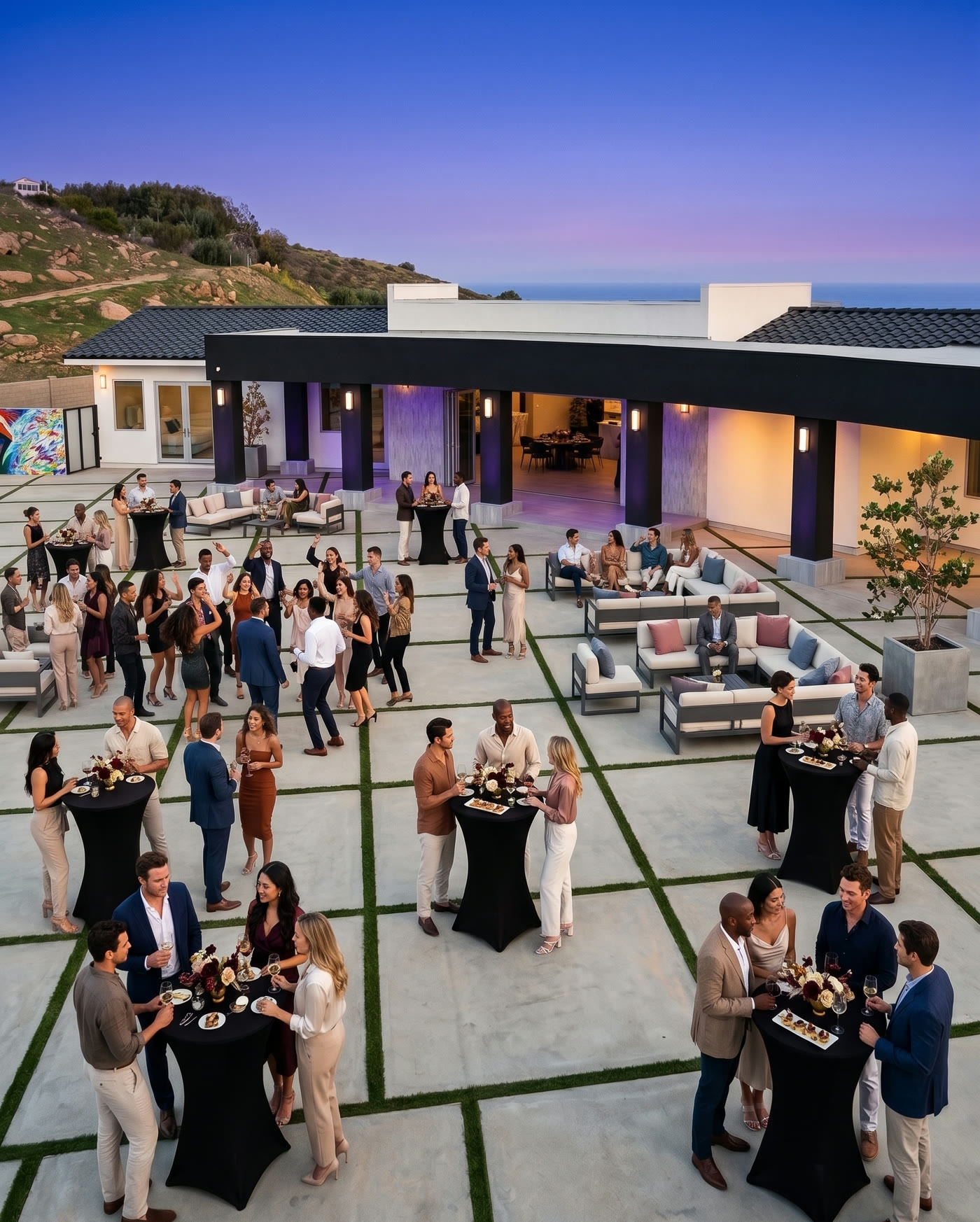 An evening gathering in the open-air courtyard of the Golden Ridge Estate at dusk